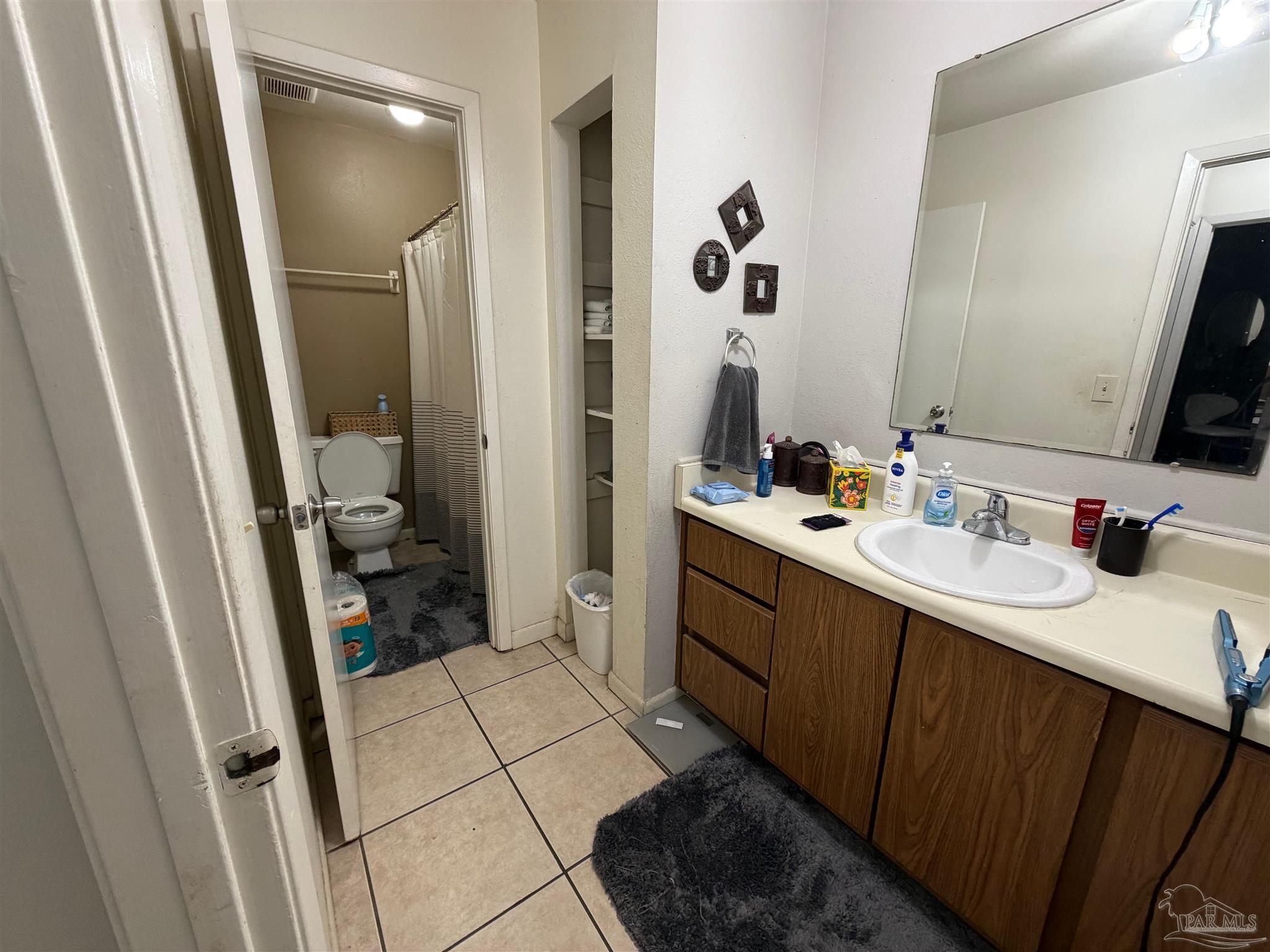 130 East 9 Mile Road Pensacola, FL 32534 - Photo 10 of 25 a bathroom with a sink and a mirror