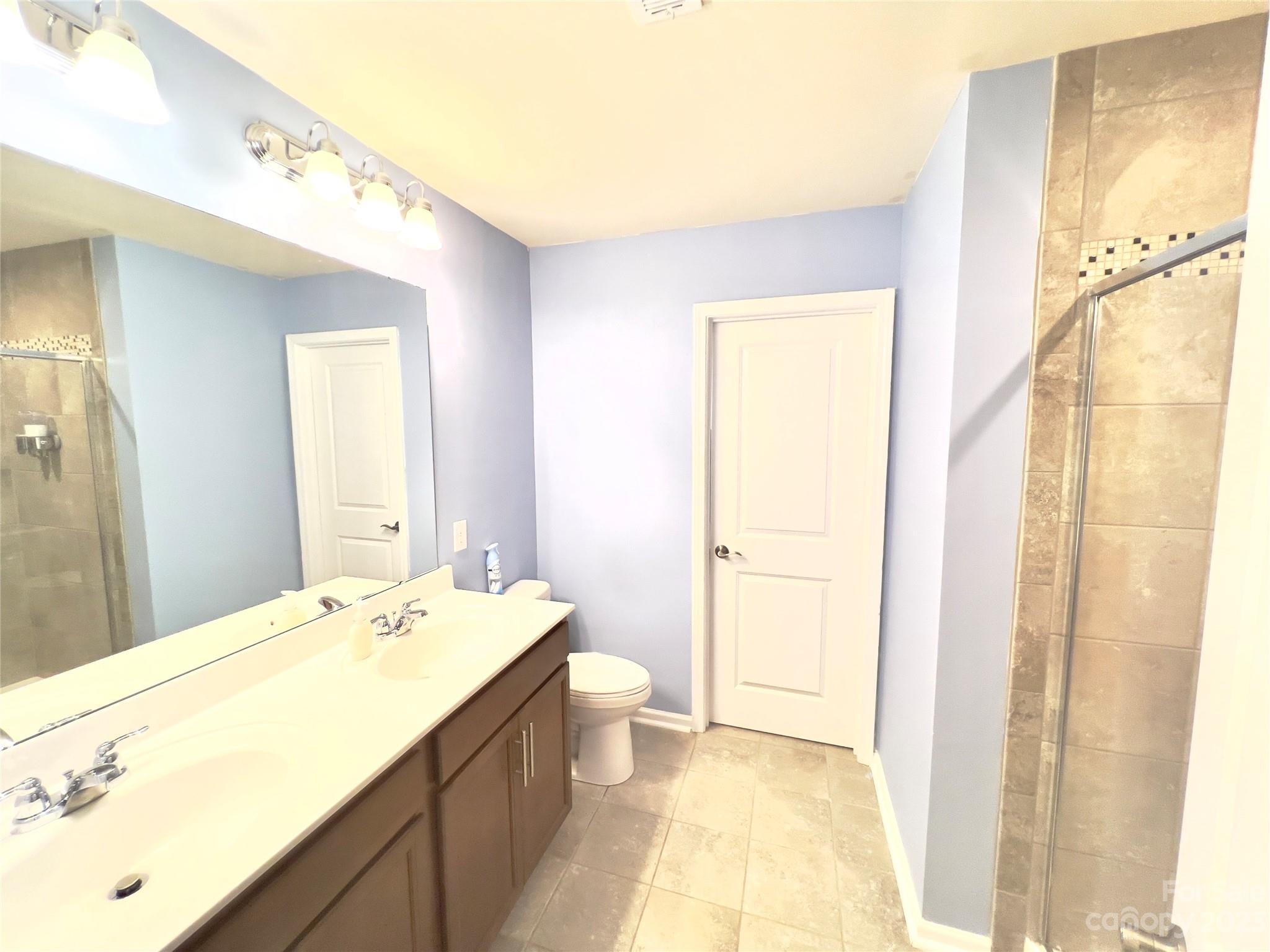 833 Canoe Song Road Fort Mill, SC 29708 - Photo 8 of 12 a bathroom with a granite countertop sink and a mirror