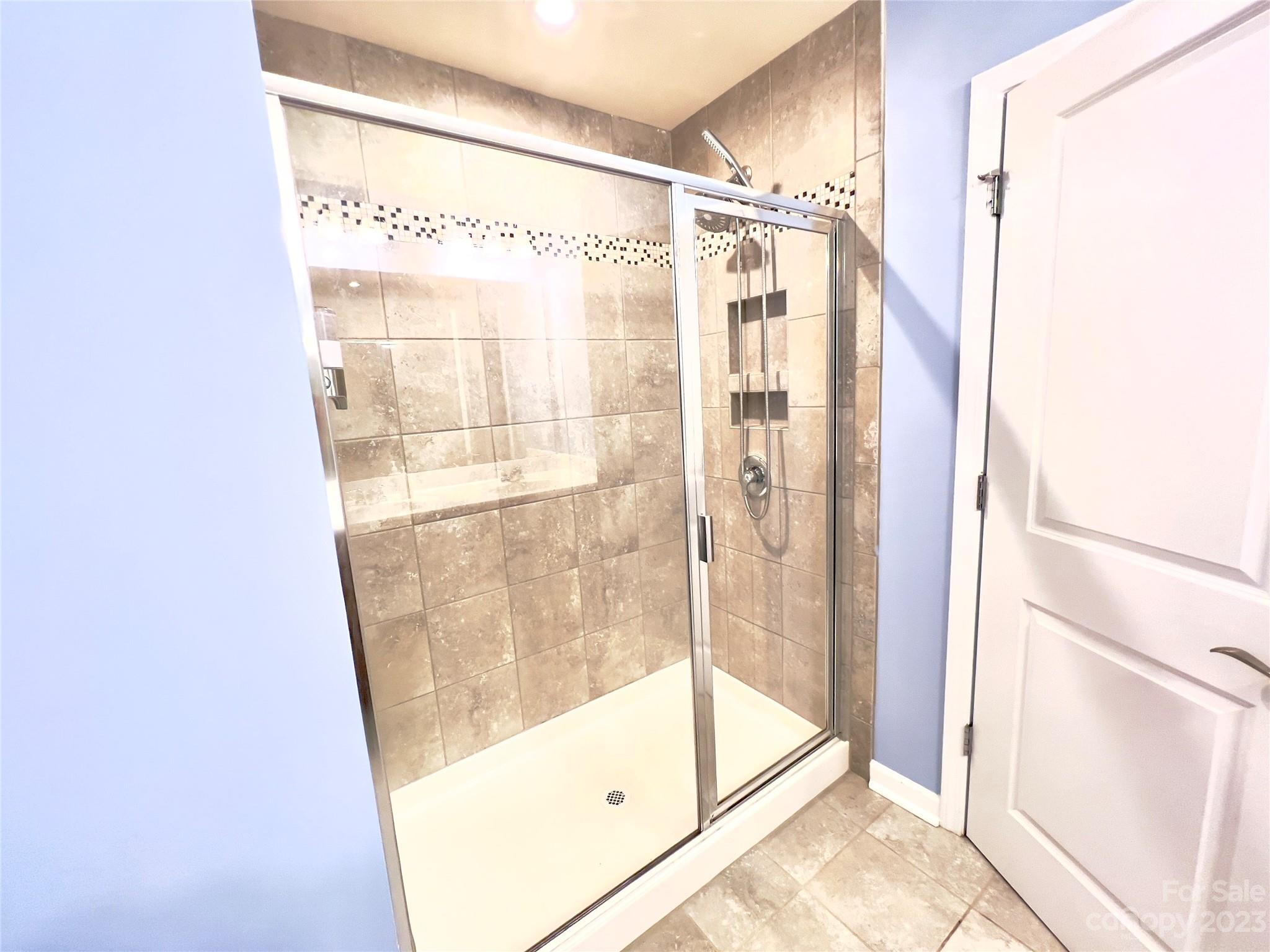 833 Canoe Song Road Fort Mill, SC 29708 - Photo 9 of 12 a bathroom with a glass shower door