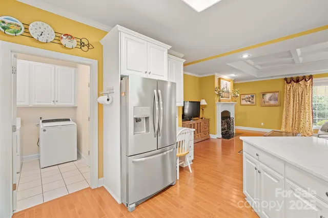 a kitchen with stainless steel appliances a refrigerator and a stove