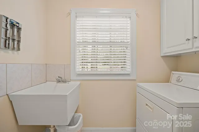 a bathroom with a sink and a window