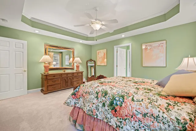 a bedroom with a bed and dresser