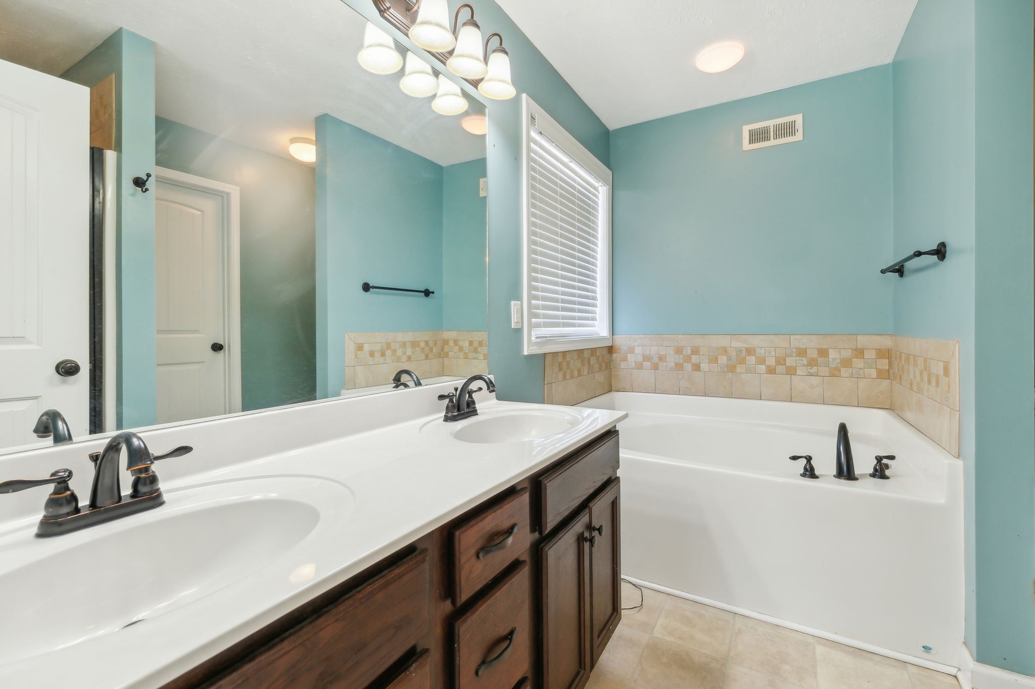 100 Riddick Court Murfreesboro, TN 37127 - Photo 24 of 56 a bathroom with a tub sink and mirror