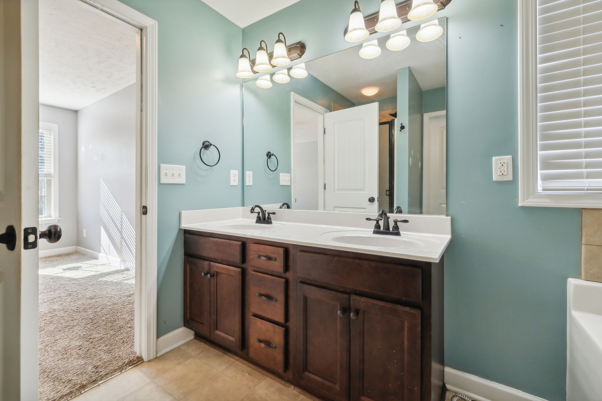 100 Riddick Court Murfreesboro, TN 37127 - Photo 25 of 56 a bathroom with a sink vanity and a mirror