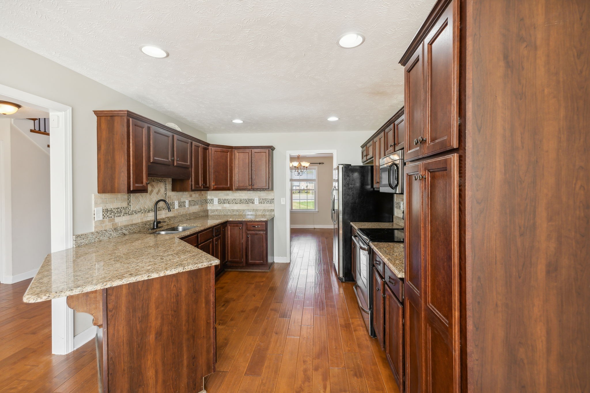 100 Riddick Court Murfreesboro, TN 37127 - Photo 10 of 56 a kitchen with stainless steel appliances granite countertop refrigerator sink and stove