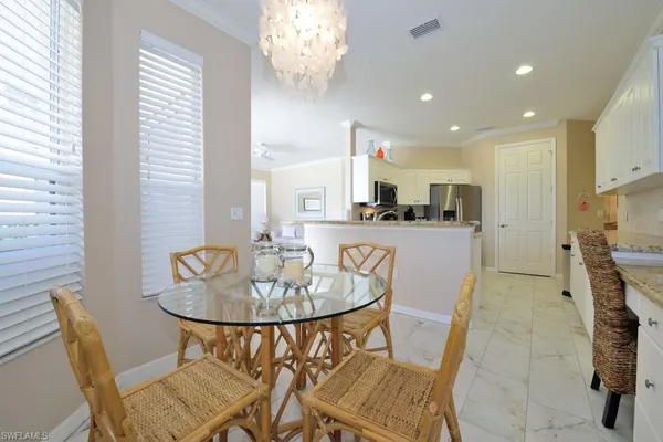 a dining room with furniture and window