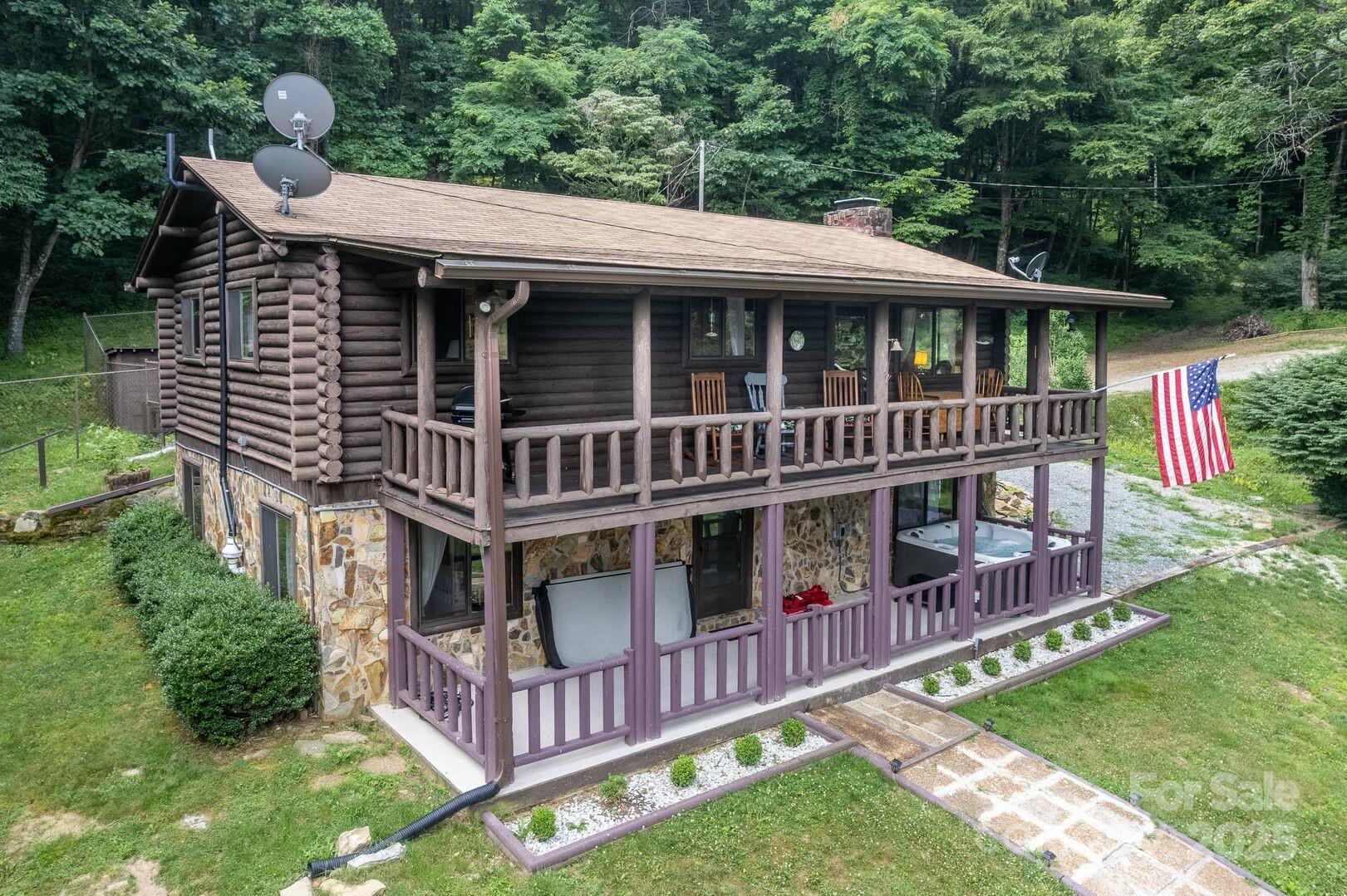 1491 Battle Branch Road Bryson City, NC 28713 - Photo 1 of 34 a view of a house with a yard and deck