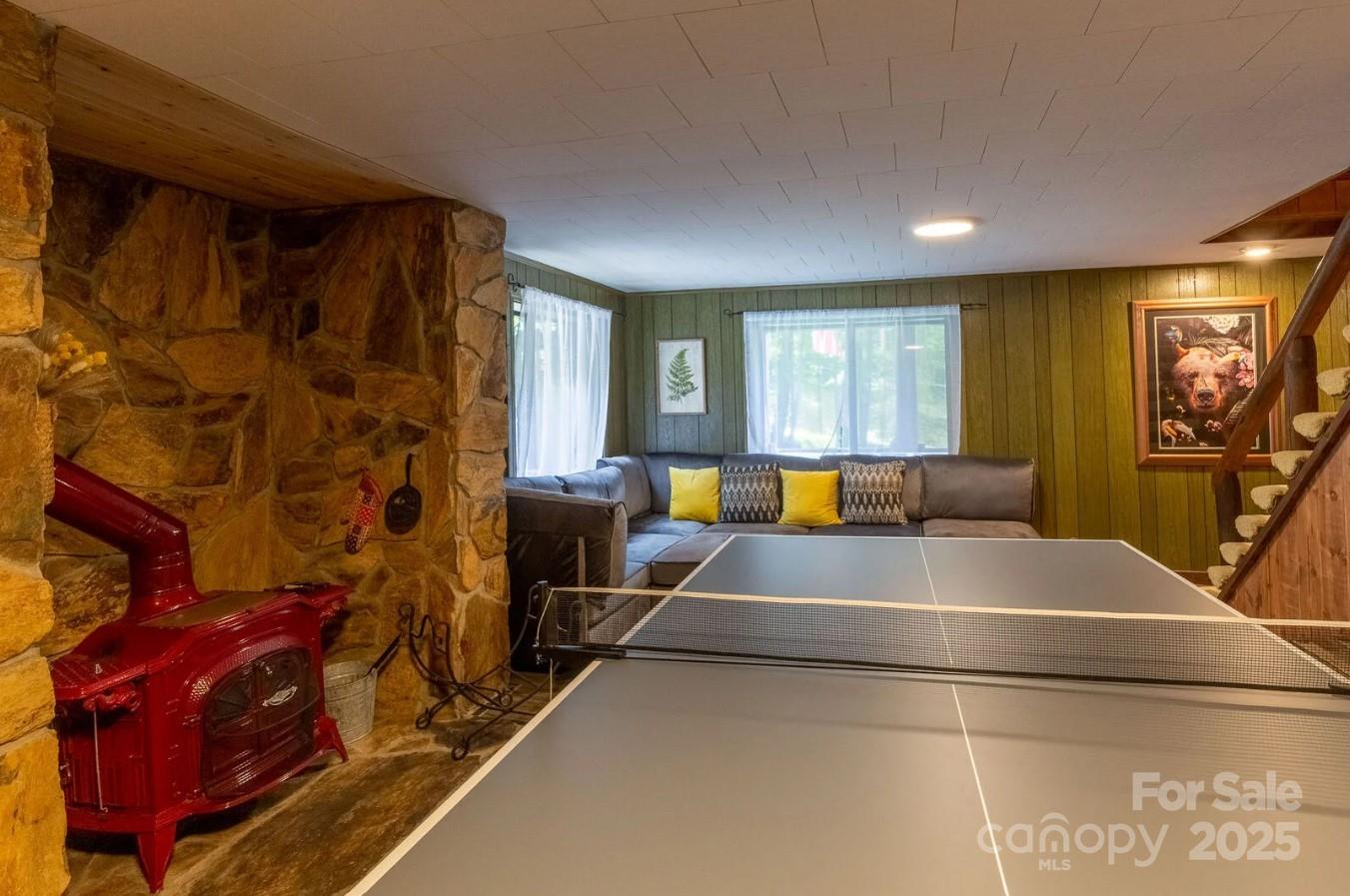 1491 Battle Branch Road Bryson City, NC 28713 - Photo 11 of 34 a living room with furniture and a flat screen tv