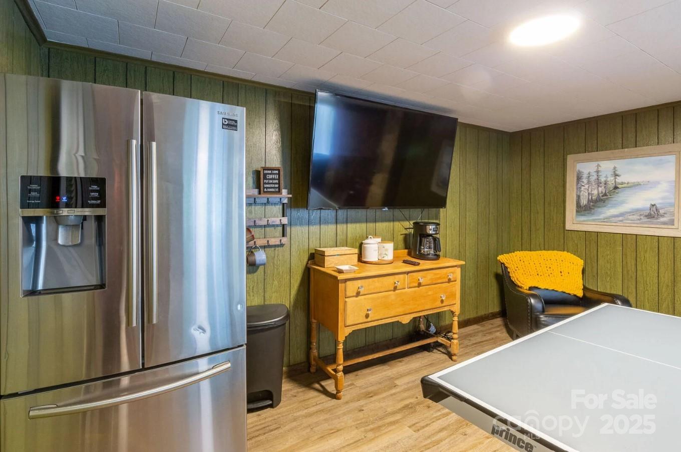 1491 Battle Branch Road Bryson City, NC 28713 - Photo 12 of 34 a kitchen with stainless steel appliances a refrigerator and a stove top oven