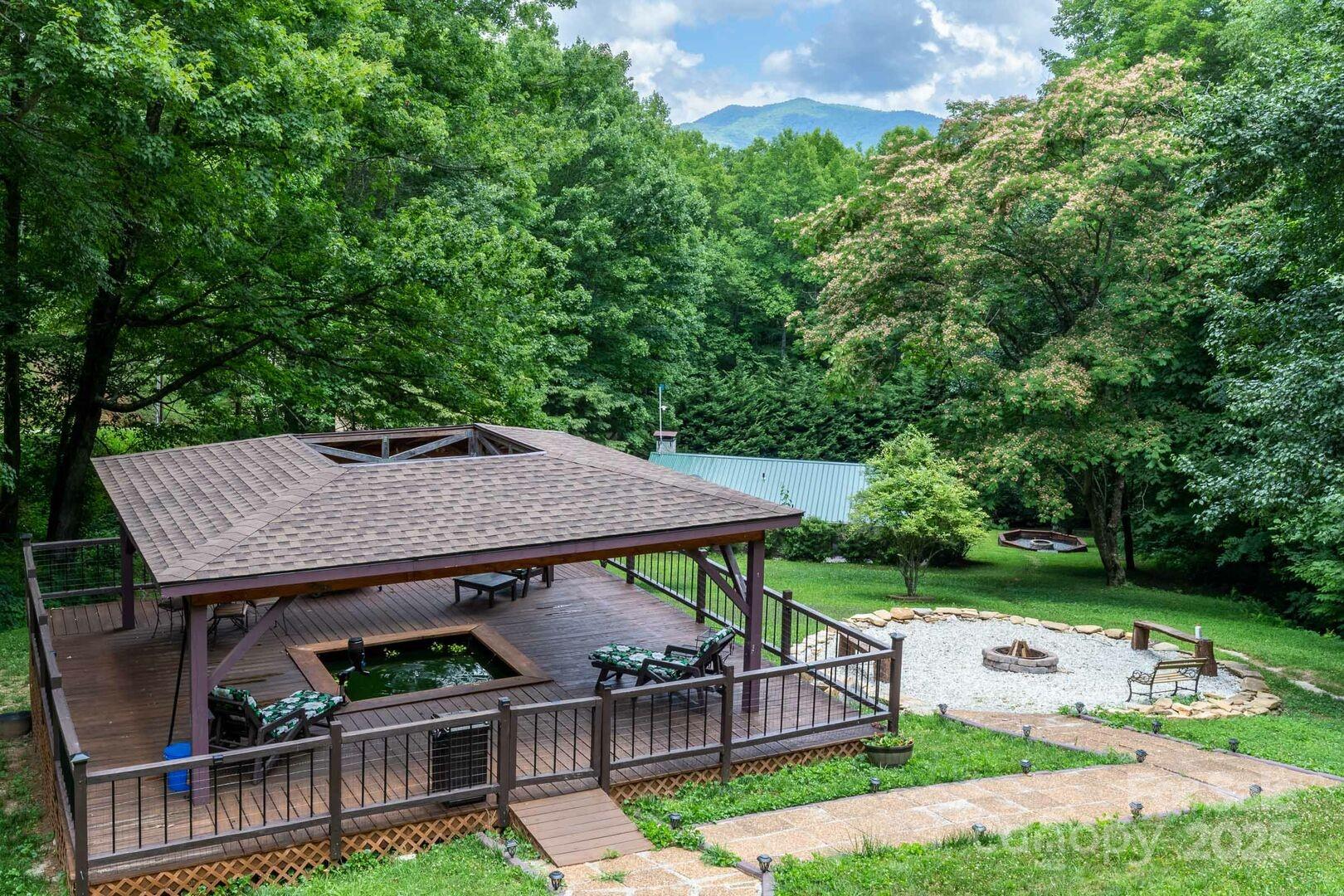1491 Battle Branch Road Bryson City, NC 28713 - Photo 28 of 34 an aerial view of a house with garden space and patio