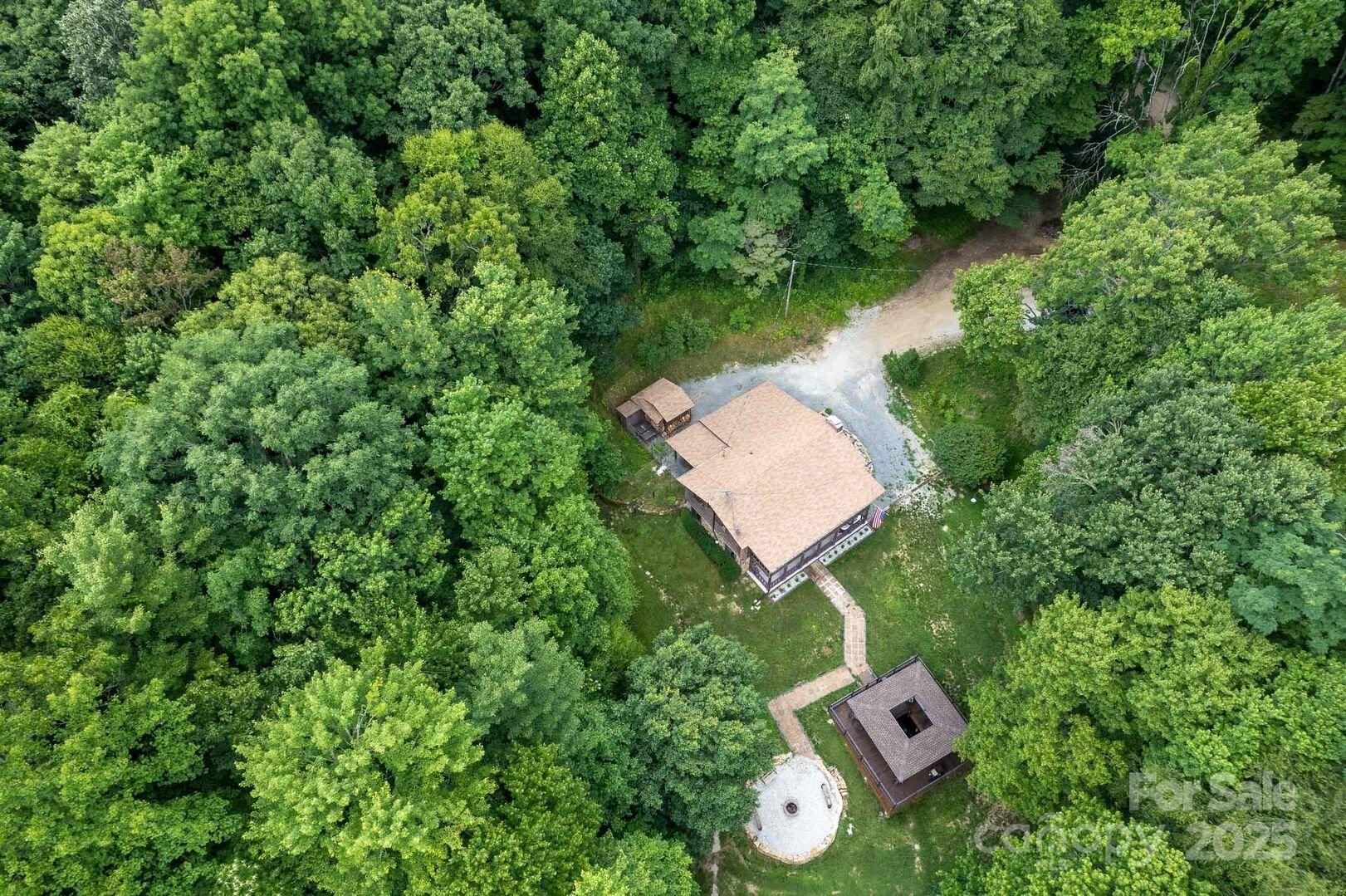 1491 Battle Branch Road Bryson City, NC 28713 - Photo 32 of 34 an aerial view of a house with swimming pool and garden space