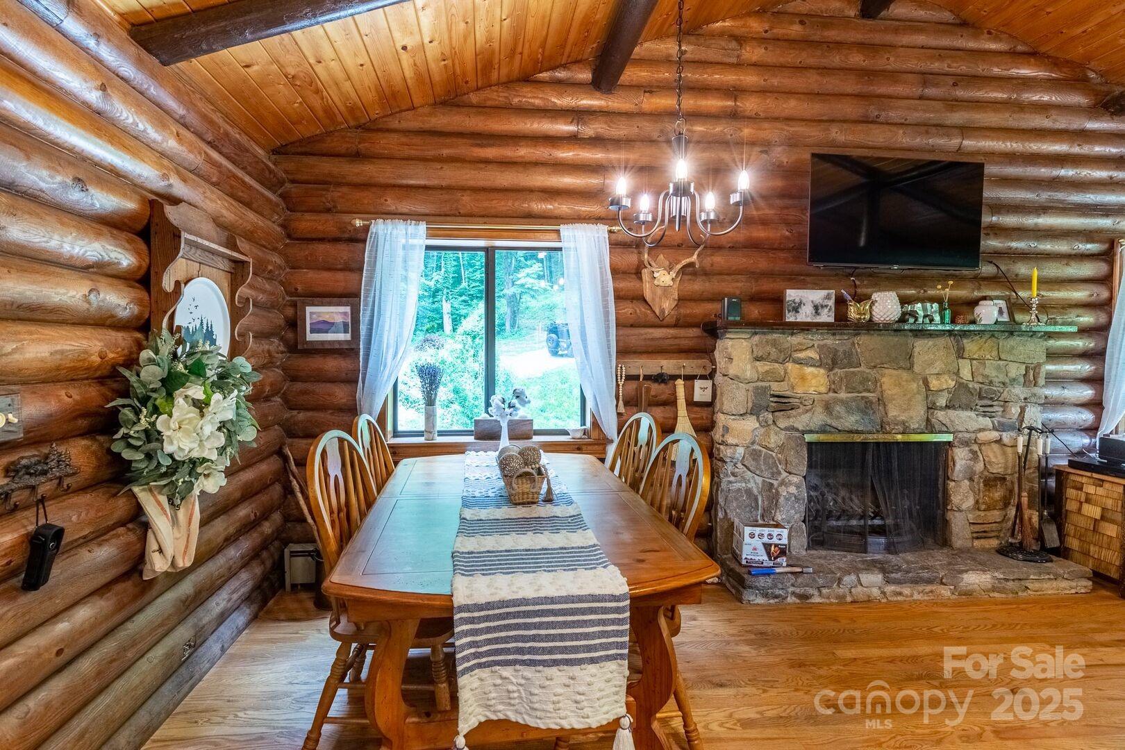 1491 Battle Branch Road Bryson City, NC 28713 - Photo 9 of 34 a view of a livingroom with furniture and a fireplace