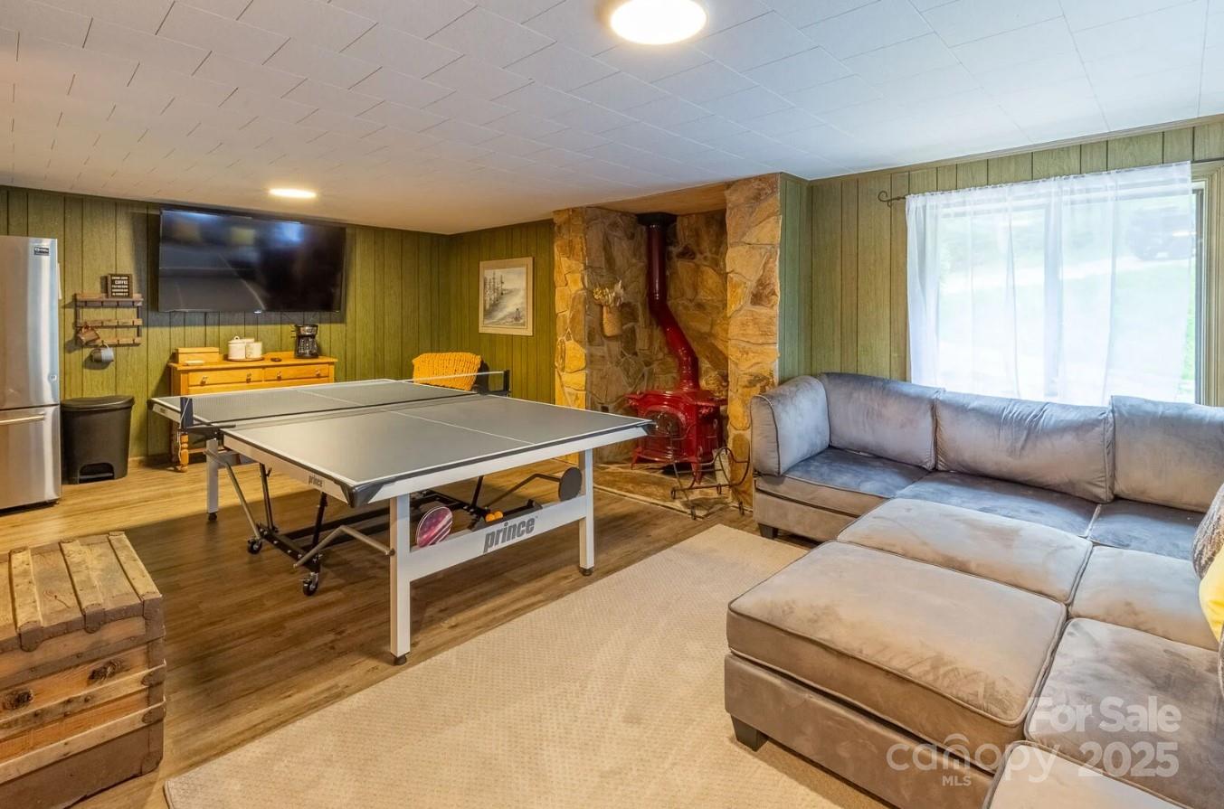 1491 Battle Branch Road Bryson City, NC 28713 - Photo 10 of 34 a living room with furniture pool table and a large window