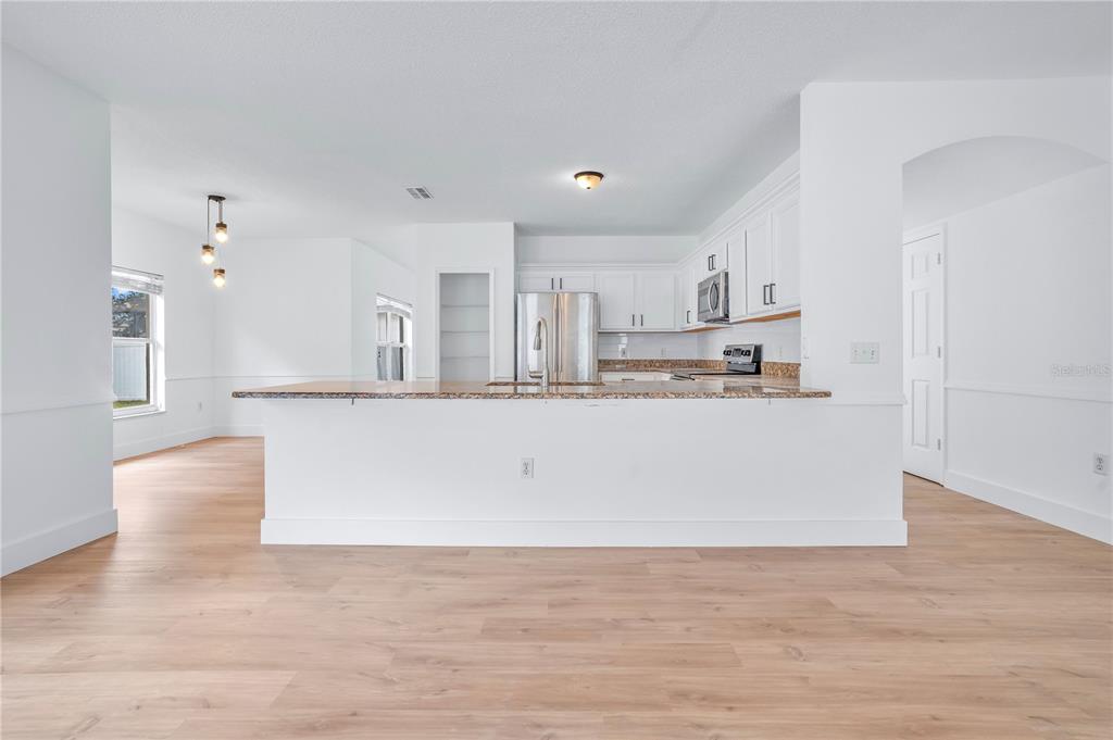 444 Acacia Tree Way Kissimmee, FL 34758 - Photo 12 of 38 a view of kitchen with stainless steel appliances cabinets