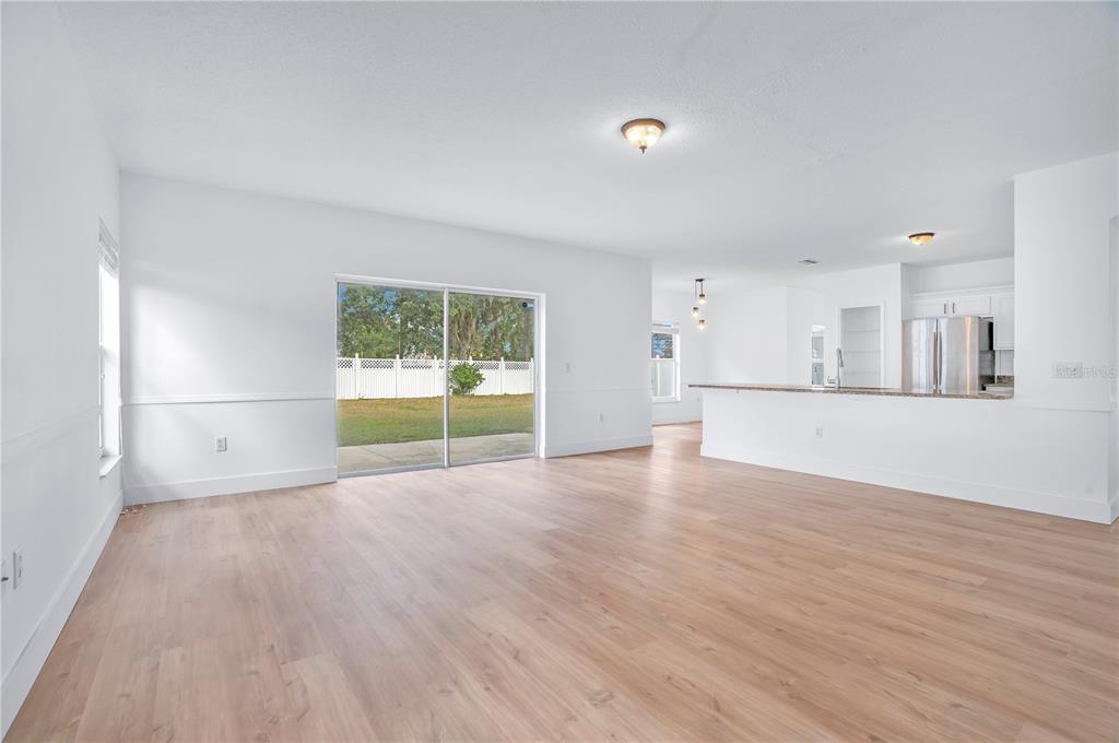 444 Acacia Tree Way Kissimmee, FL 34758 - Photo 14 of 38 a view of a kitchen with a sink and a window