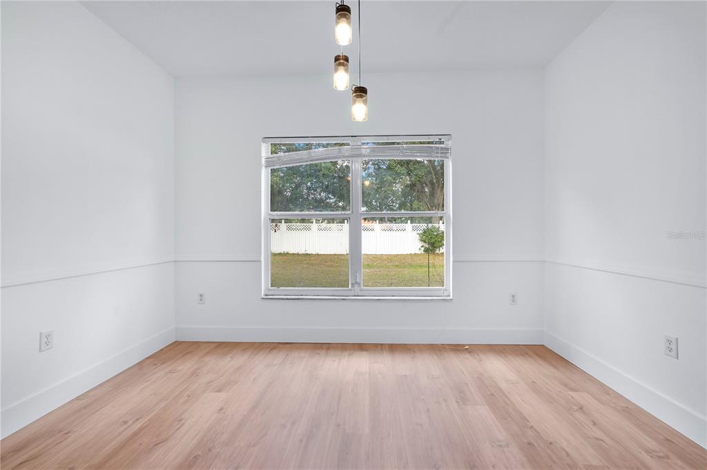 444 Acacia Tree Way Kissimmee, FL 34758 - Photo 16 of 38 an empty room with a window
