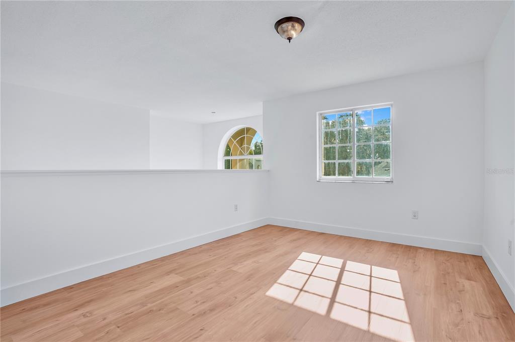 444 Acacia Tree Way Kissimmee, FL 34758 - Photo 22 of 38 an empty room with windows