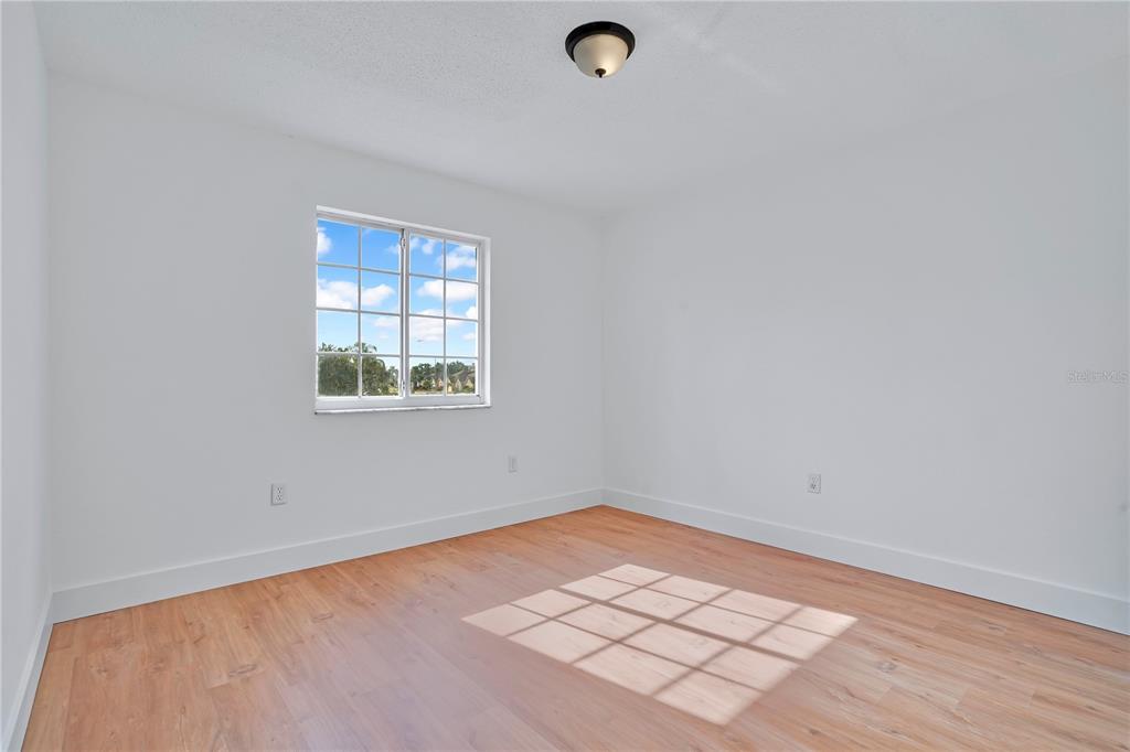 444 Acacia Tree Way Kissimmee, FL 34758 - Photo 23 of 38 an empty room with a window