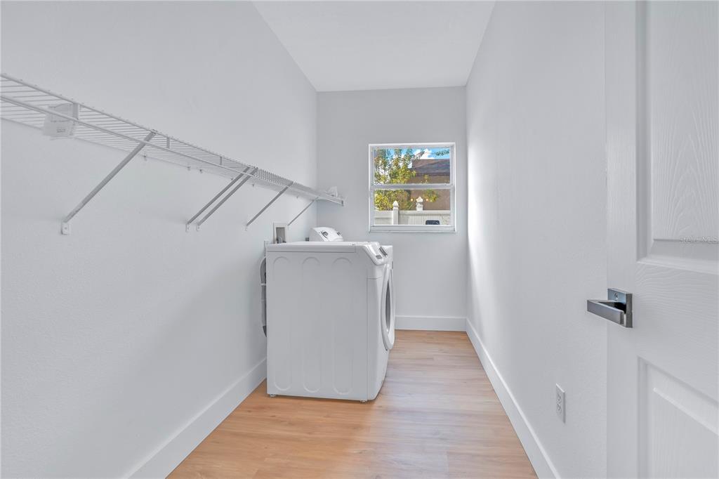 444 Acacia Tree Way Kissimmee, FL 34758 - Photo 29 of 38 a view of a storage & utility room with a window