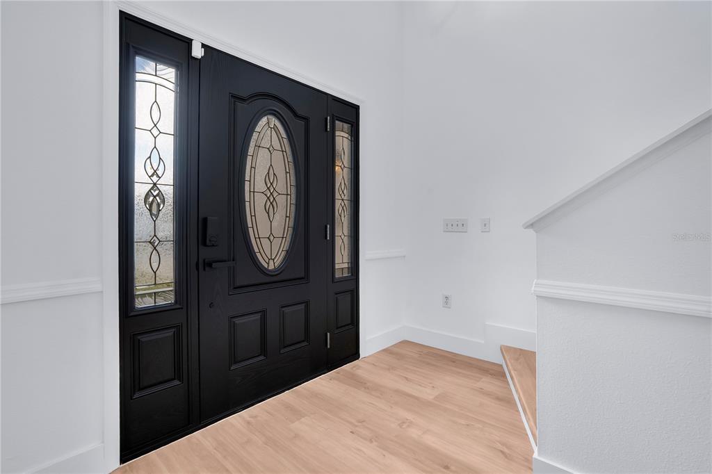 444 Acacia Tree Way Kissimmee, FL 34758 - Photo 3 of 38 a view of a hallway with elevator