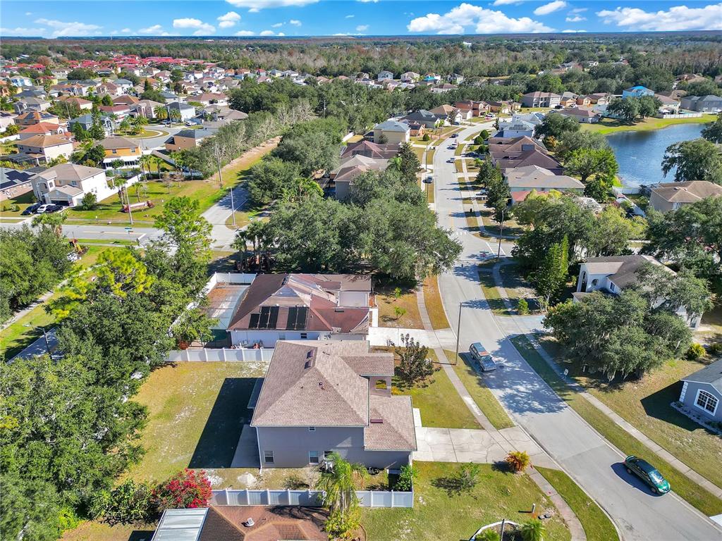444 Acacia Tree Way Kissimmee, FL 34758 - Photo 35 of 38 an aerial view of residential houses with outdoor space and river
