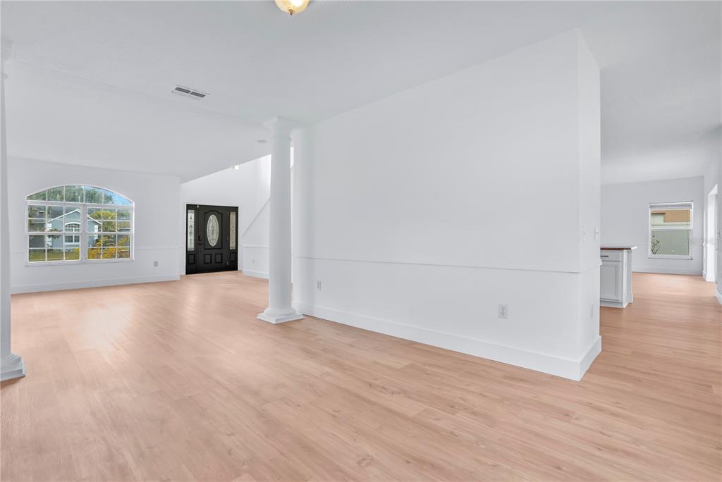 444 Acacia Tree Way Kissimmee, FL 34758 - Photo 6 of 38 an empty room with windows and entrance