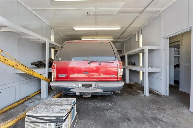 a bed room with furniture and a flat screen tv