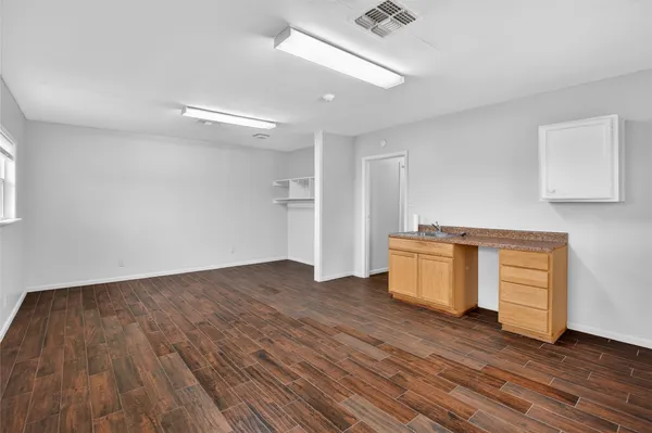 a kitchen with a refrigerator and a sink