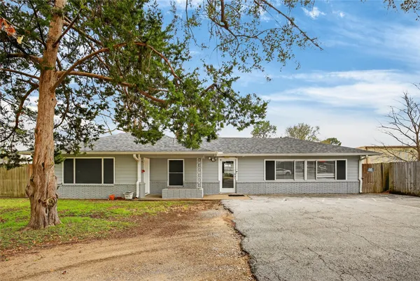 a tree in the garden of a house
