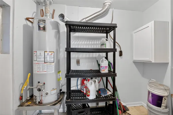 a view of a room with wooden floor and window