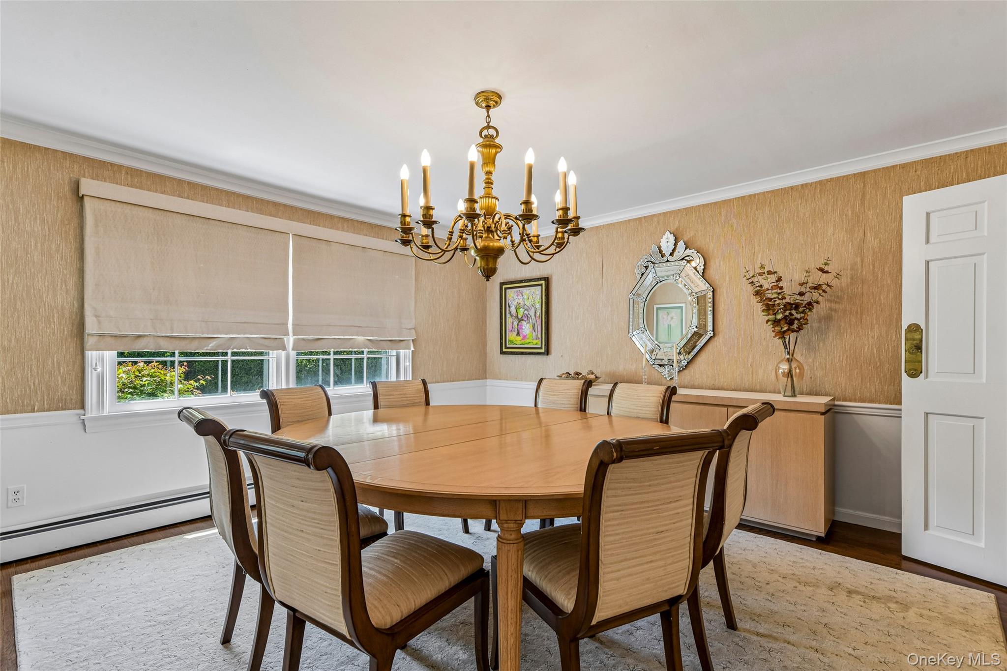 100 Hewlett Neck Road Woodmere, NY 11598 - Photo 11 of 45 a view of a dining room with furniture a chandelier and wooden floor