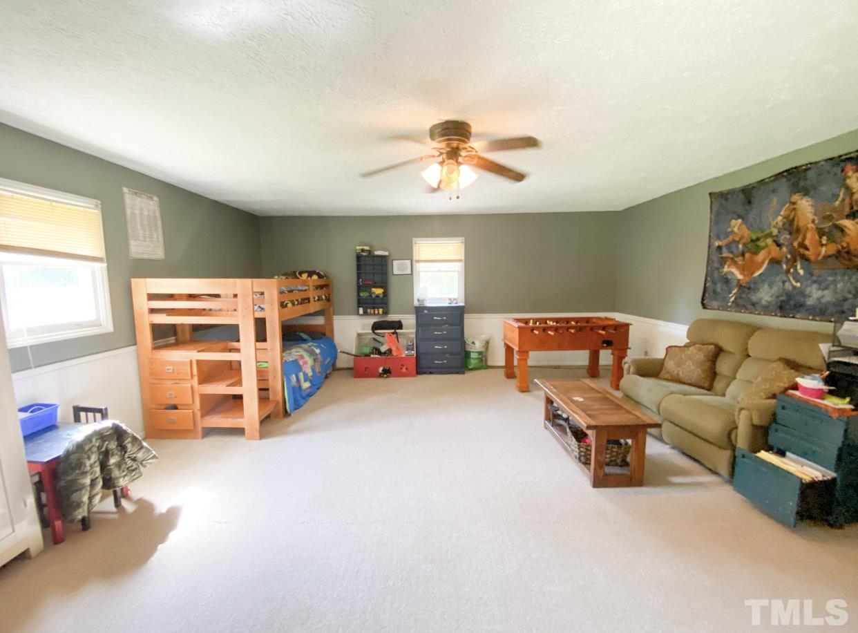 105 Lawson Farm Road Roxboro, NC 27574 - Photo 11 of 25 a bedroom with furniture and a window