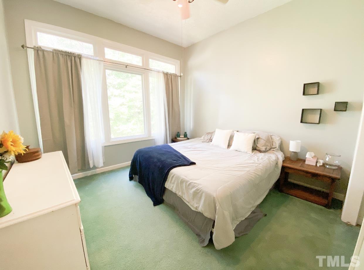 105 Lawson Farm Road Roxboro, NC 27574 - Photo 16 of 25 a bedroom with a bed and a window