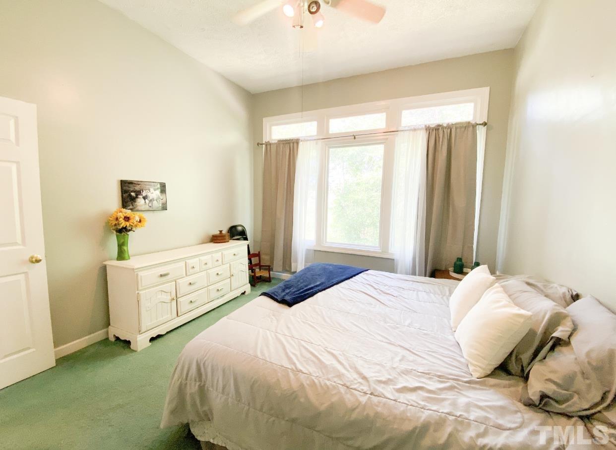 105 Lawson Farm Road Roxboro, NC 27574 - Photo 17 of 25 a bedroom with a bed and a window