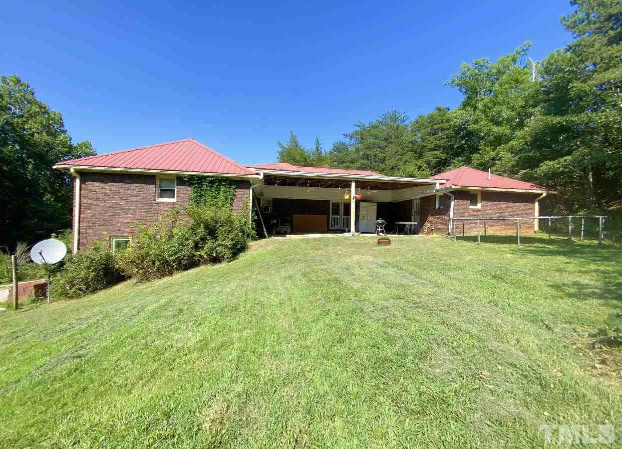 105 Lawson Farm Road Roxboro, NC 27574 - Photo 24 of 25 a view of a house with a yard and sitting area
