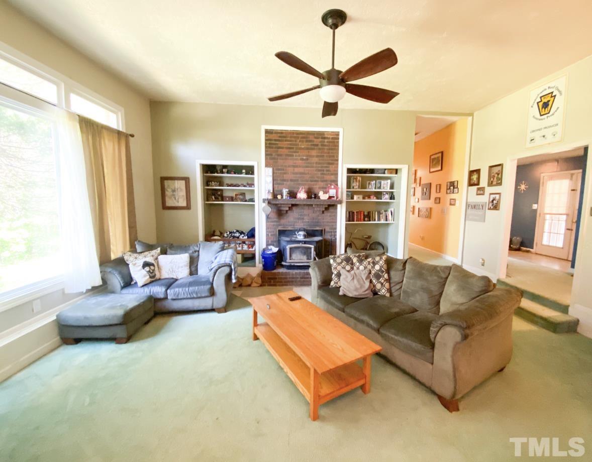 105 Lawson Farm Road Roxboro, NC 27574 - Photo 4 of 25 a living room with fireplace furniture and a large window