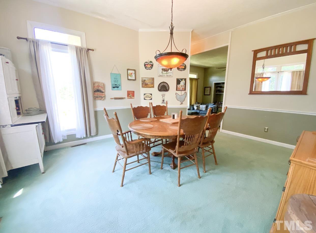 105 Lawson Farm Road Roxboro, NC 27574 - Photo 6 of 25 a view of a dining room with furniture window and wooden floor