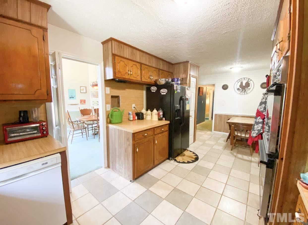 105 Lawson Farm Road Roxboro, NC 27574 - Photo 7 of 25 a kitchen with a sink appliances and cabinets