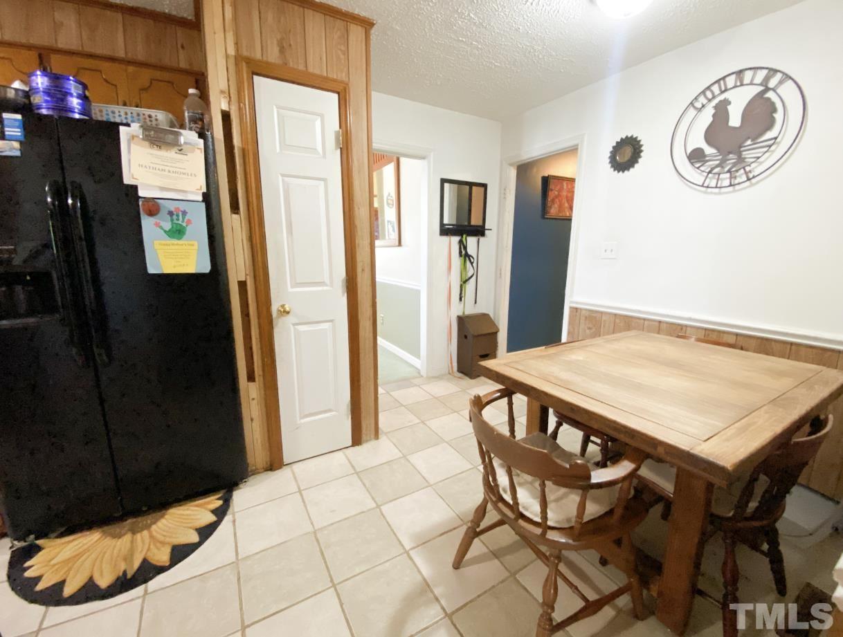 105 Lawson Farm Road Roxboro, NC 27574 - Photo 9 of 25 a view of a dining room with furniture and a table