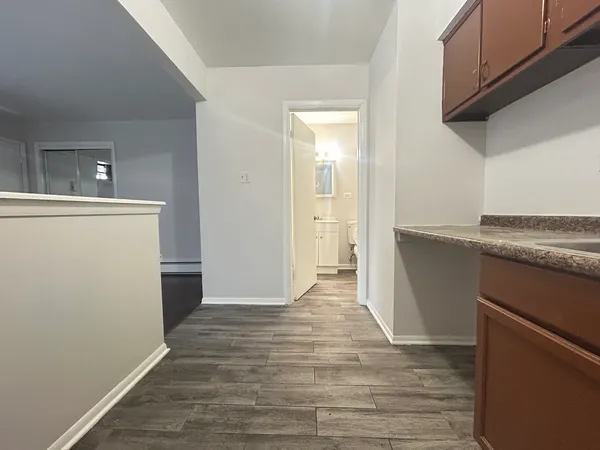 a view of a kitchen from the hallway