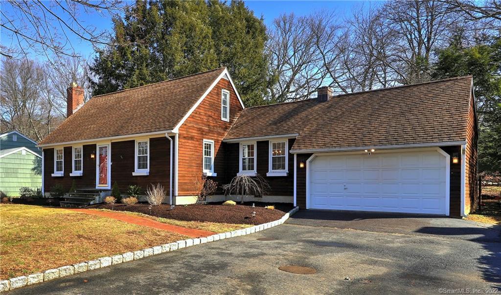 37 Robinwood Road Trumbull, CT 06611 - Photo 1 of 1 a front view of a house with a yard and garage