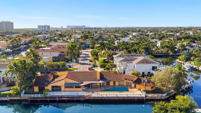 an aerial view of a house with a ocean view