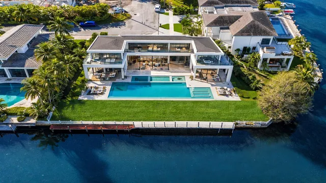 an aerial view of house with yard swimming pool and outdoor seating