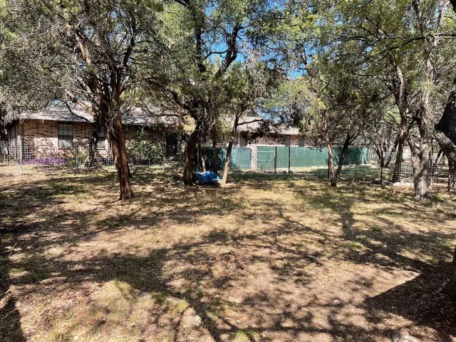 a view of outdoor space with deck and tree