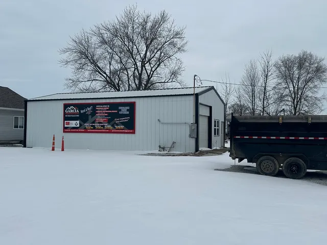 a view of garage and a car