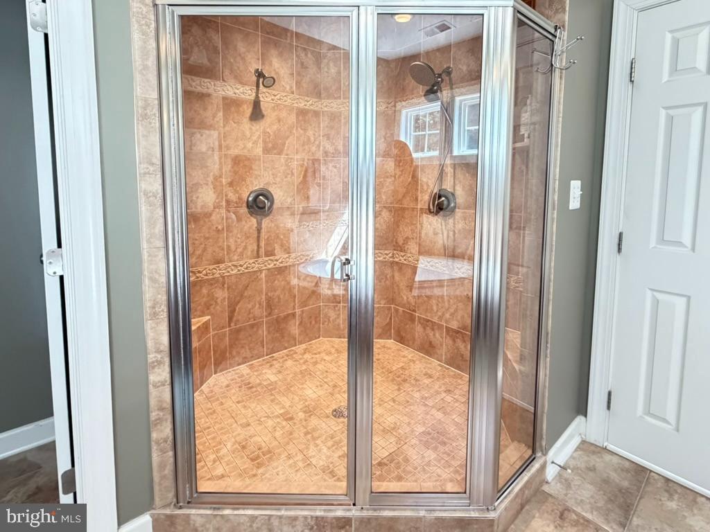 9804 Anvil Court Perry Hall, MD 21128 - Photo 14 of 21 a bathroom with a glass shower door