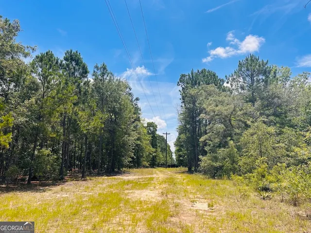 a view of a swimming pool with an outdoor space and seating area