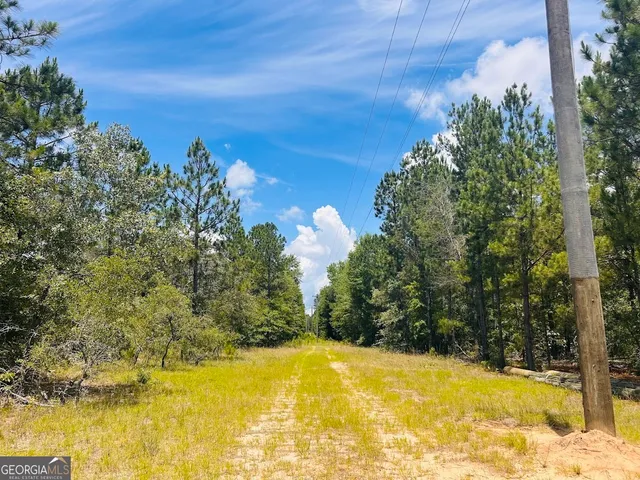 a view of a swimming pool with an outdoor space and seating area