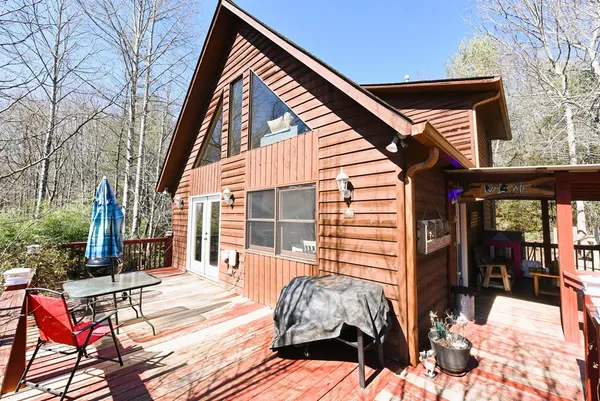 a view of backyard with a patio
