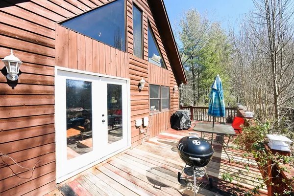 a view of a patio with table and chairs and potted plants